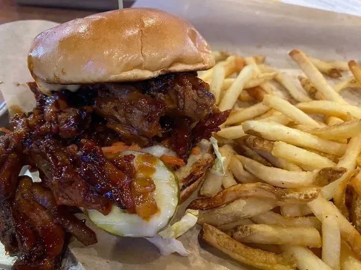 A plate with a burger and fries