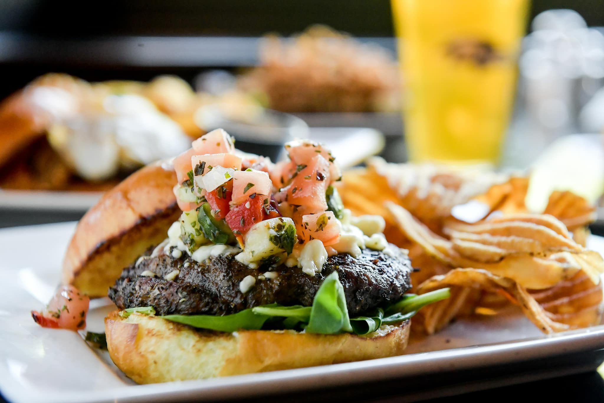 A burger with potato chips