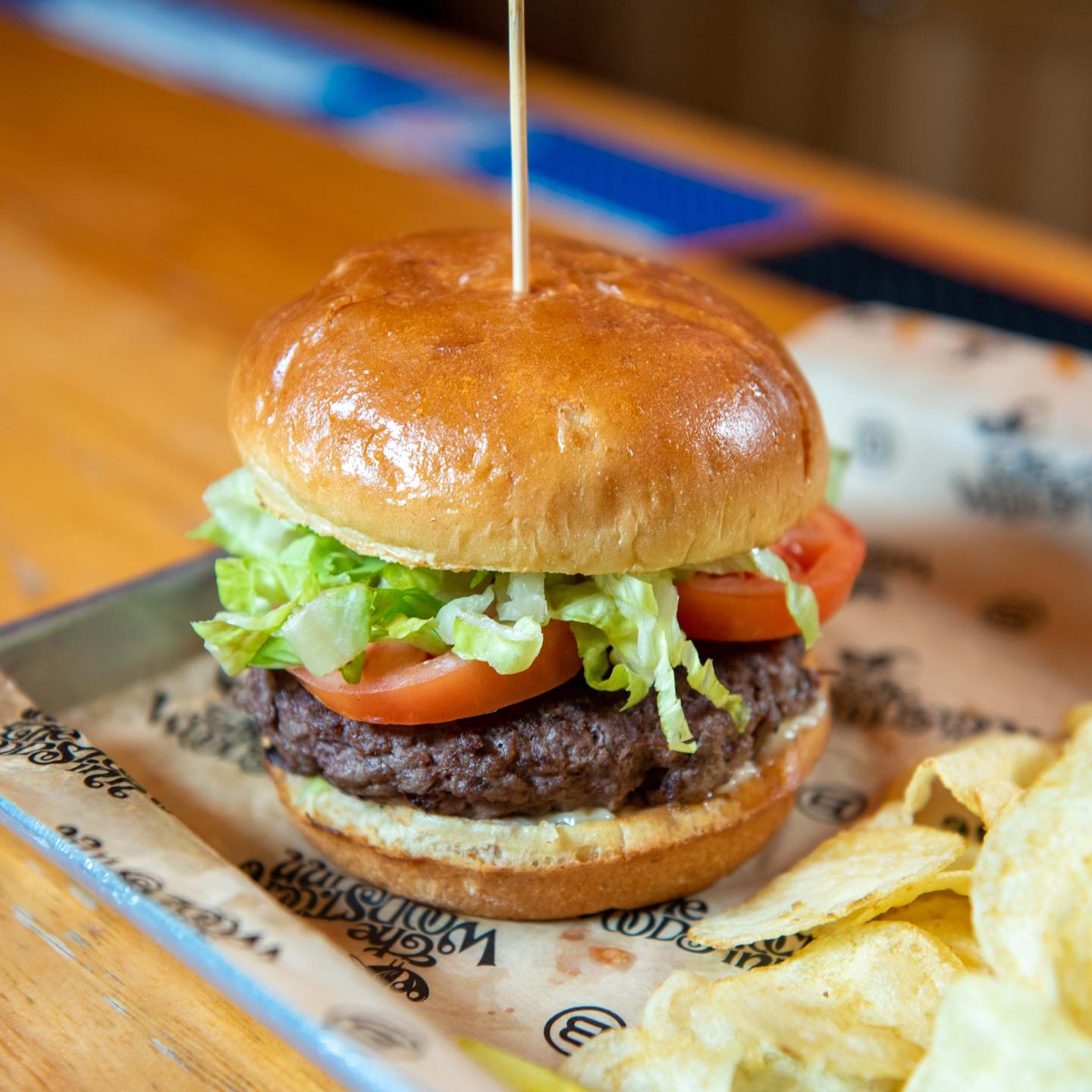 A burger with potato chips