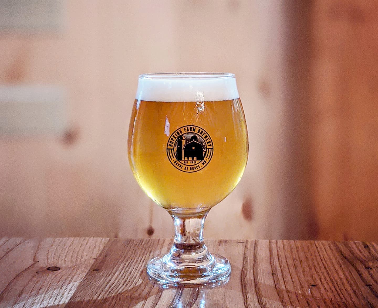 a glass of beer on a table