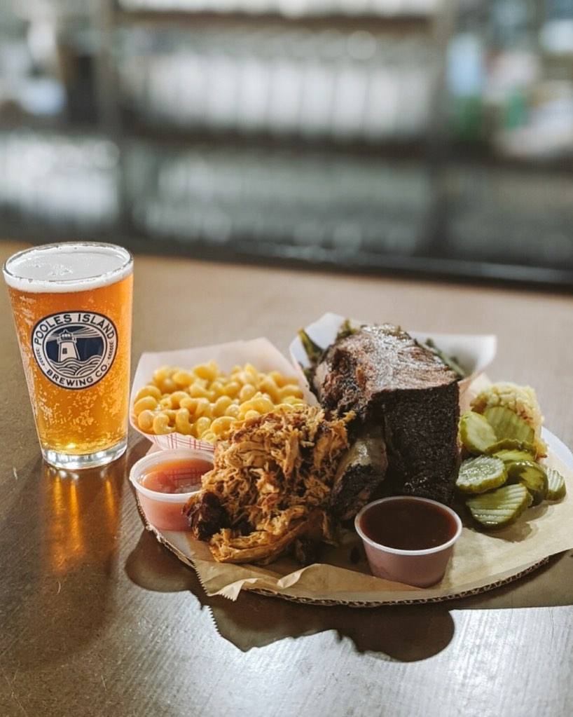 ribs with sides and a pint on the bar top