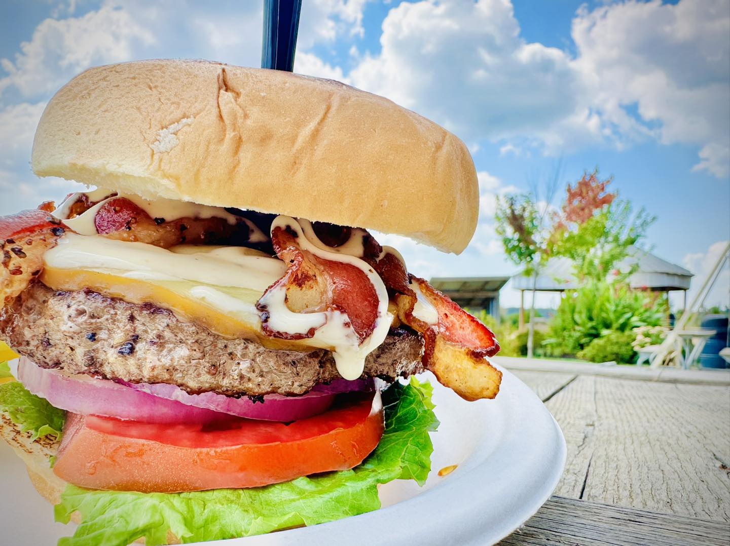 A bacon gouda burger on a plate