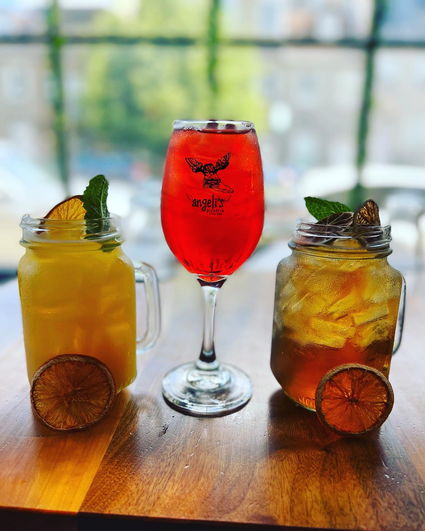 three cocktails on a table