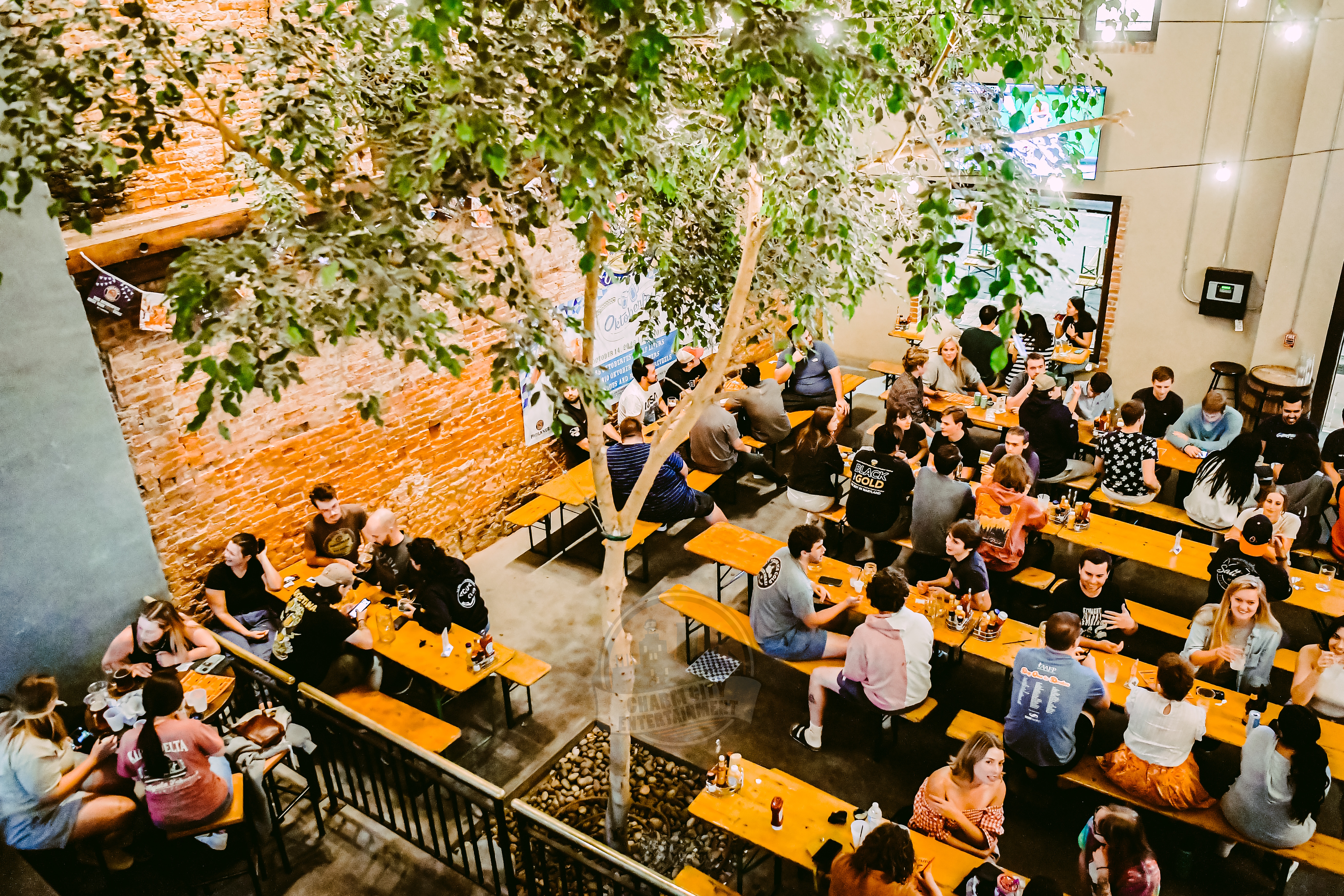 interior of crossbar with people sitting at tables