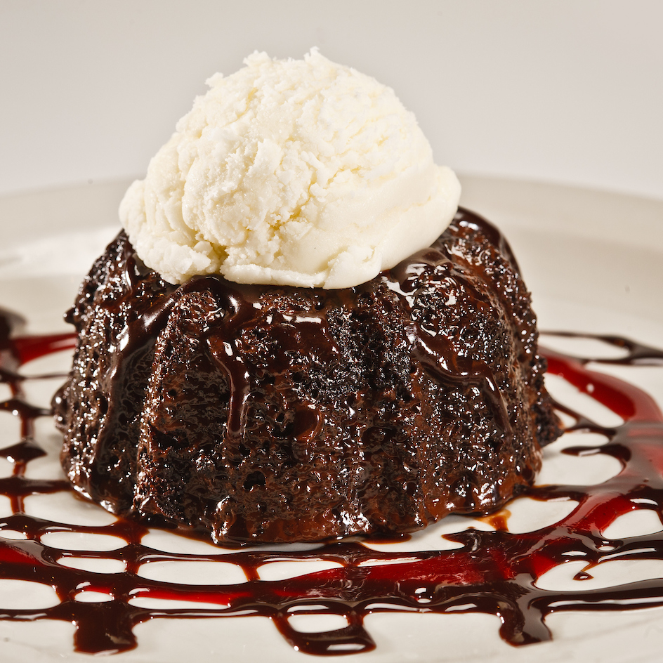 a chocolate lava cake with vanilla ice cream