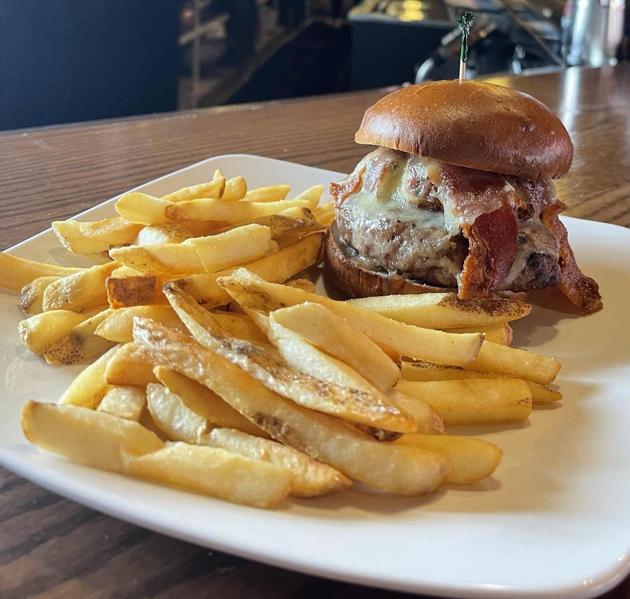 a burger with bacon and fries