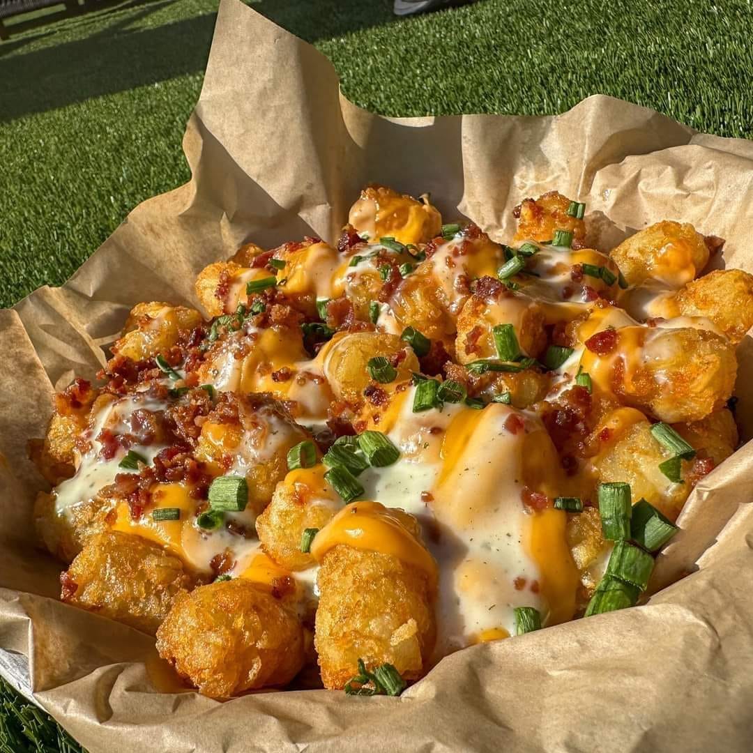 a tray of cheesy tots