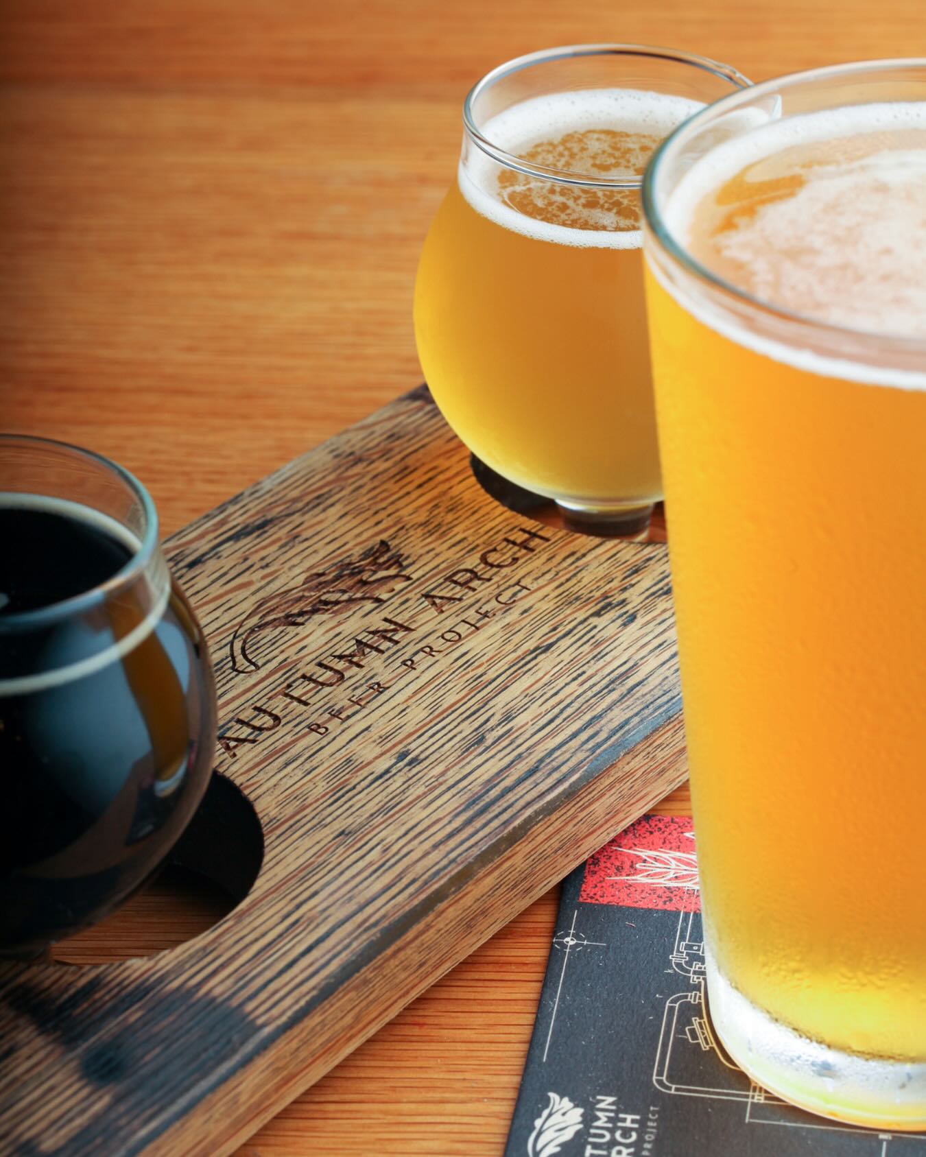 a flight of beer and a glass of beer