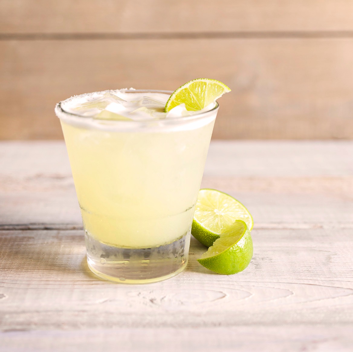 a margarita with a lime wedge