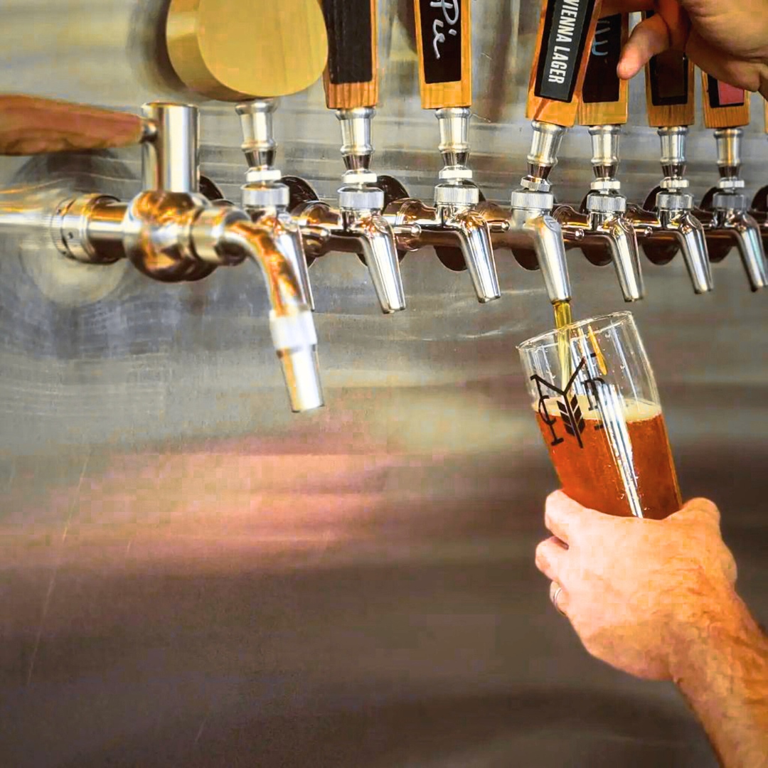 a row of beer taps