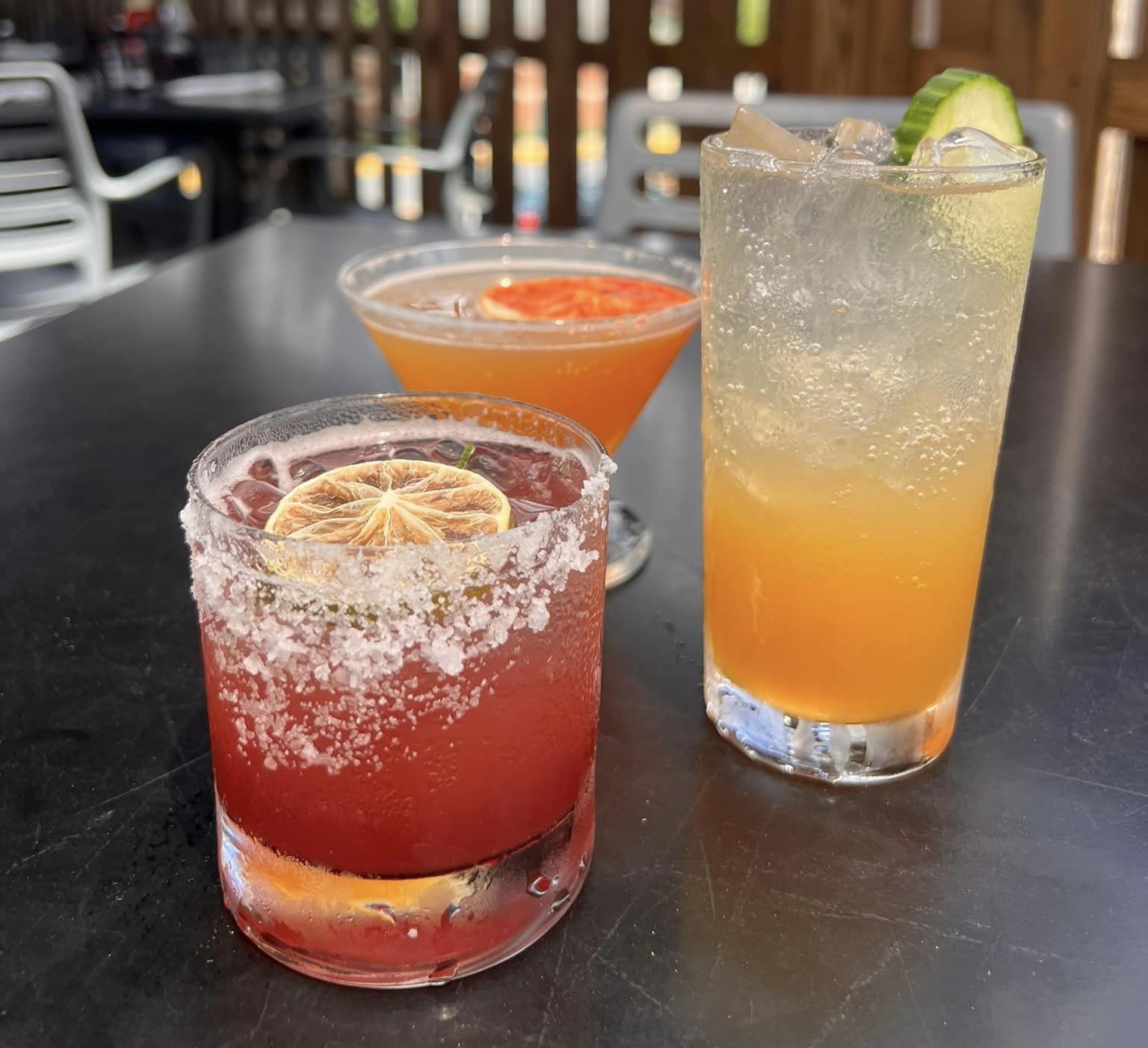 a Pom Pom Margarita, a Golden Kiwi Gimlet, and a Blood orange martini