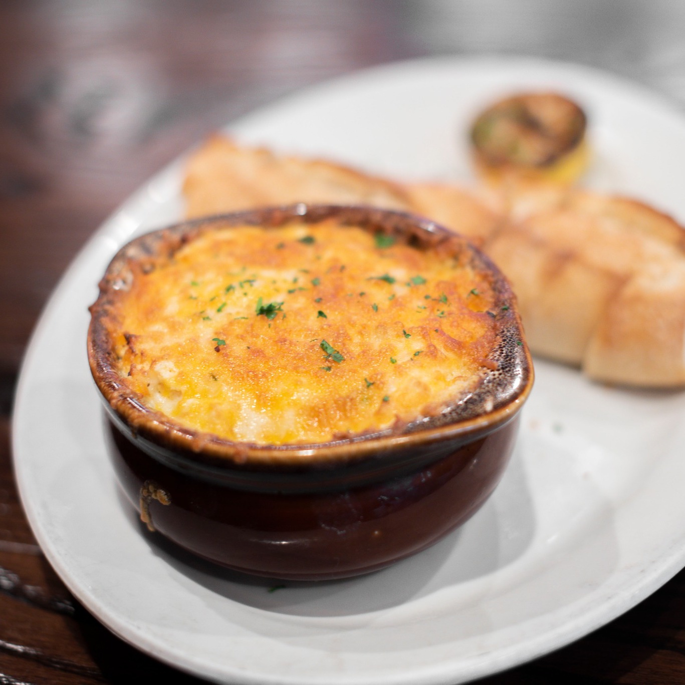 a bowl of crab dip with bread