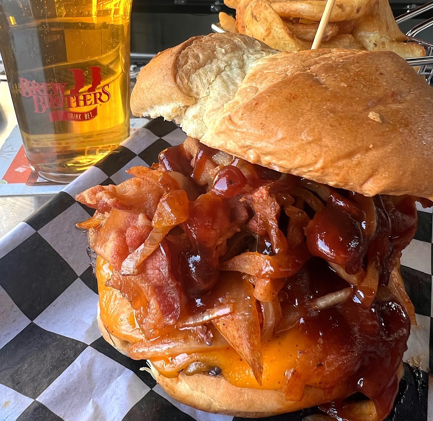 a burger with a glass of beer