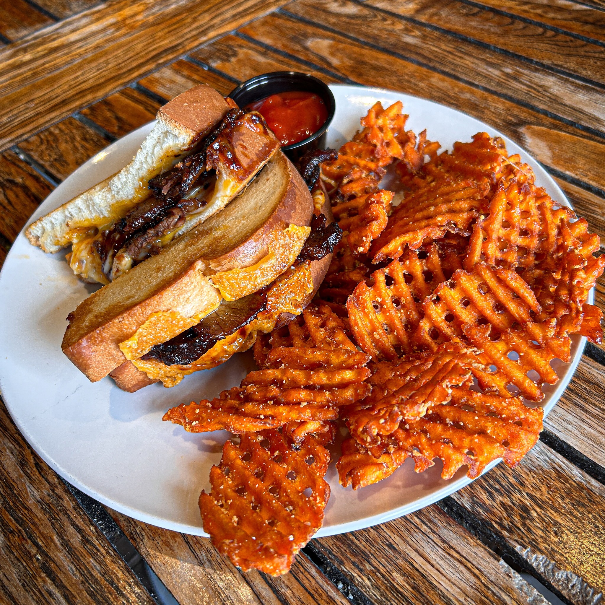 a short rib grilled cheese with sweet potato waffle fries