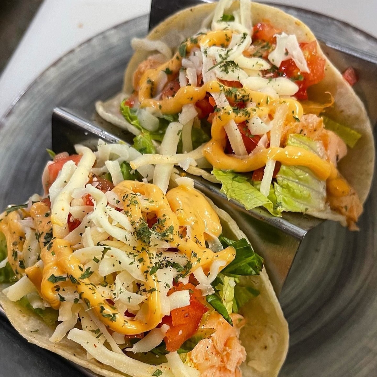 two soft shell salmon tacos