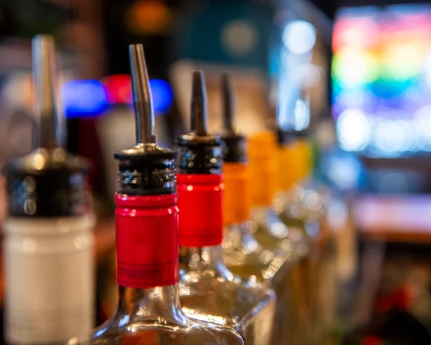 a row of liqueur bottles