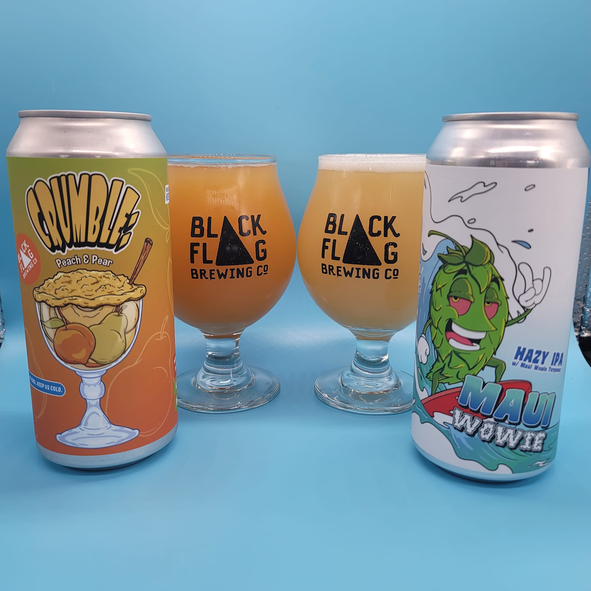 a can and a glass of CRUMBLE: PEACH & PEAR sour, and a can and a glass of MAUI WOWIE hazy ipa