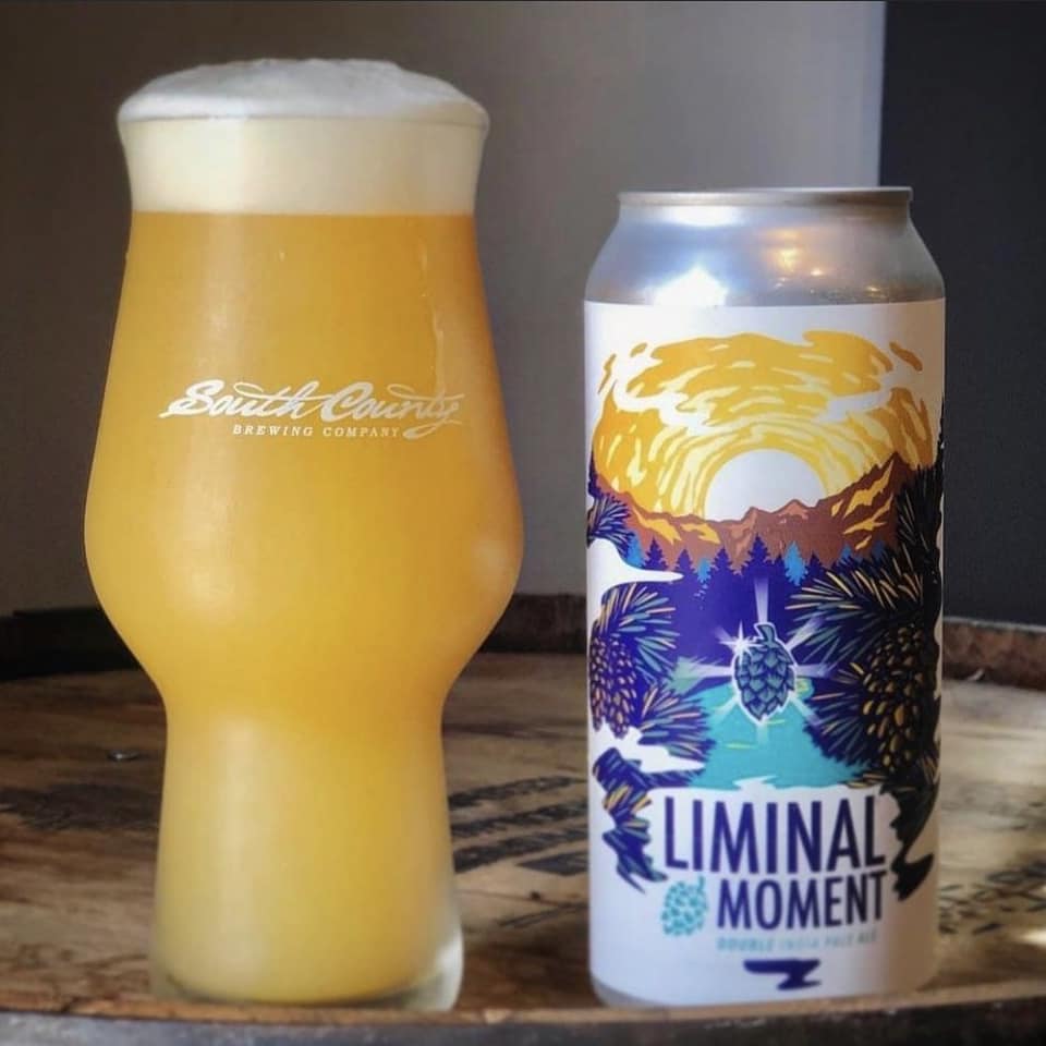 a glass and a can of liminal moment beer