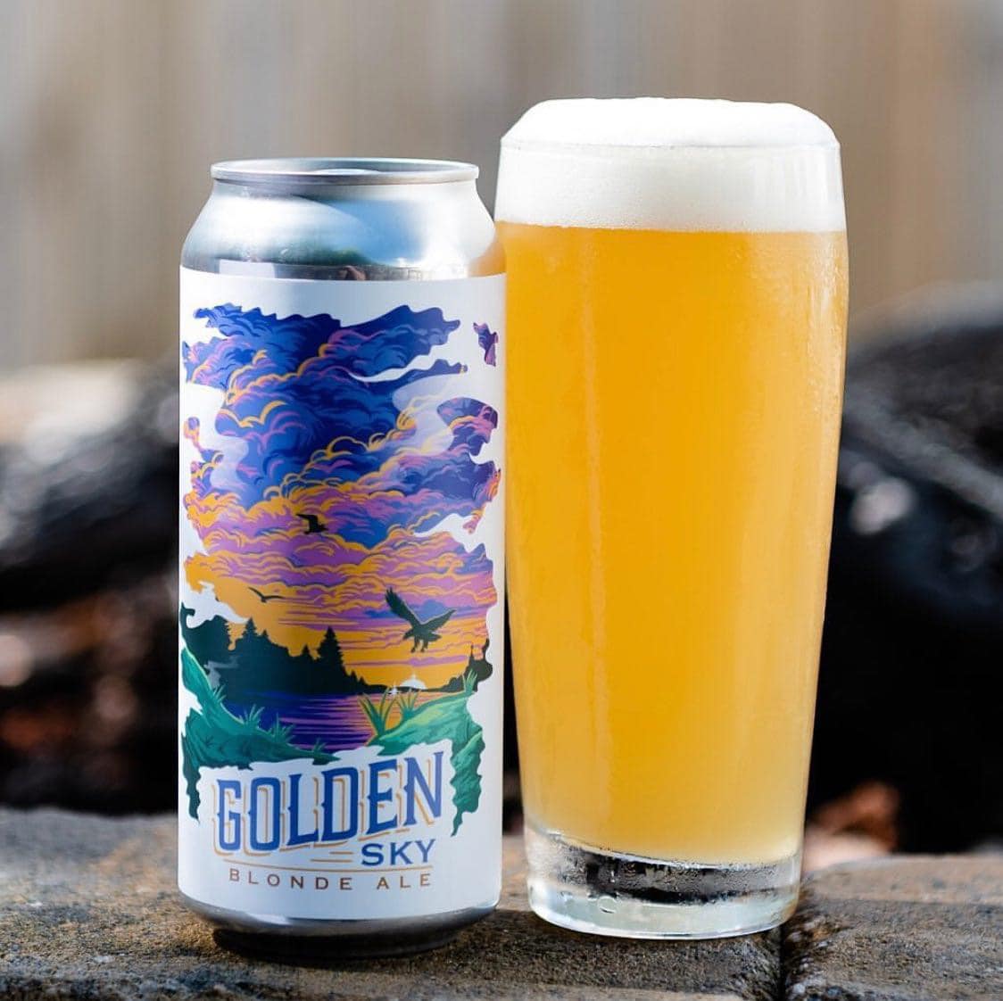 a glass and a can of golden sky beer