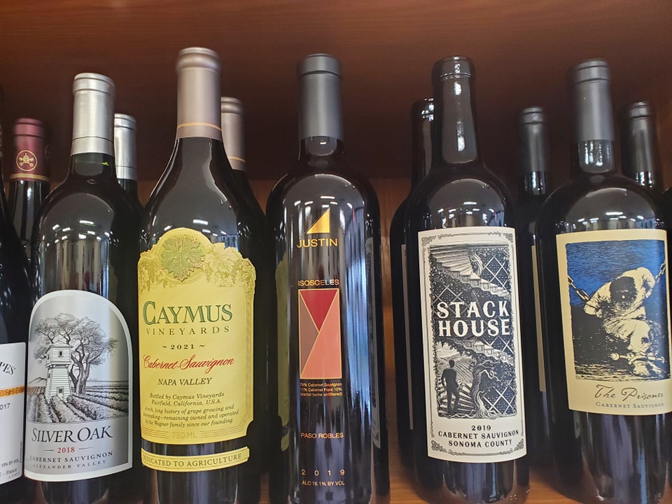 several bottles of wine on a shelf