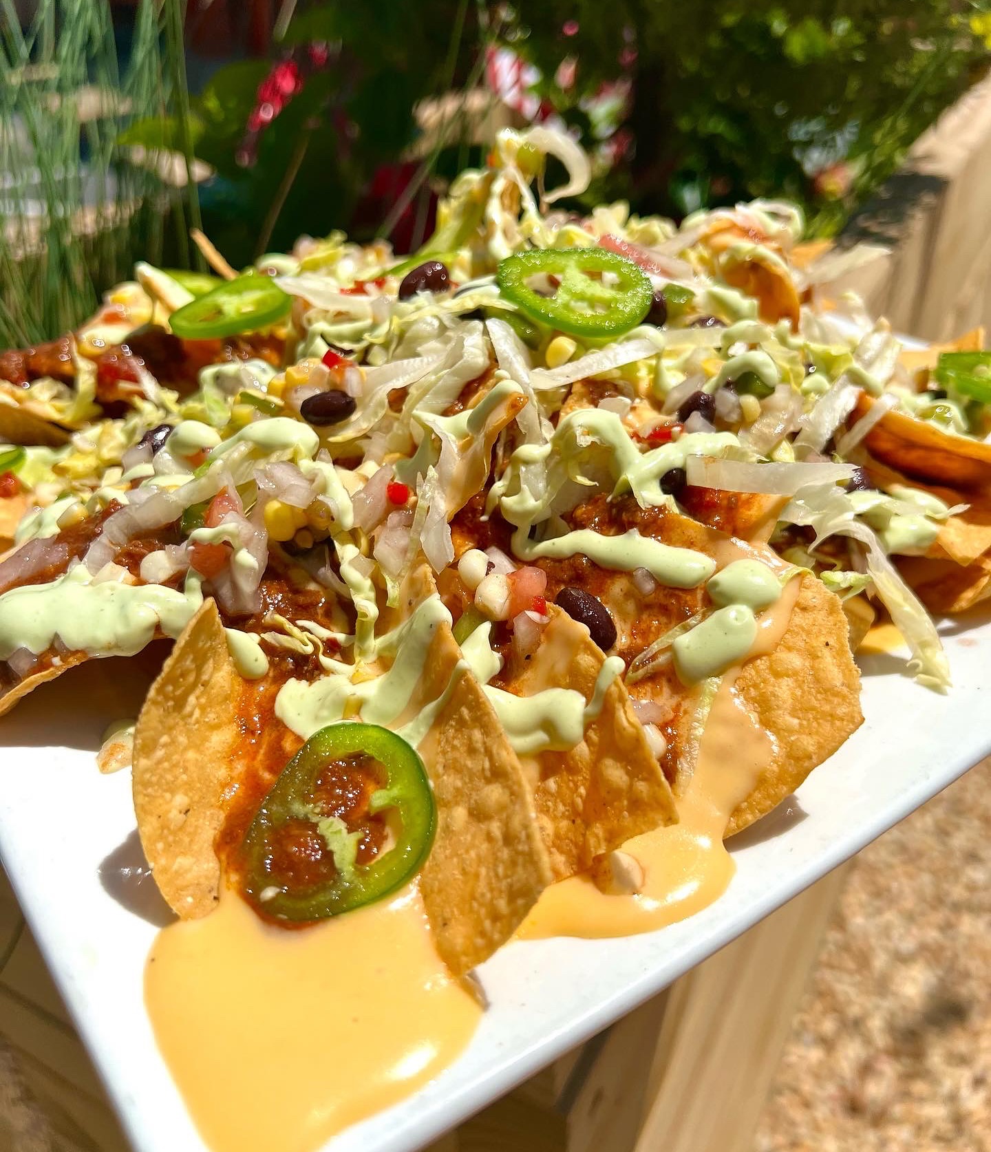 a plate of loaded nachos