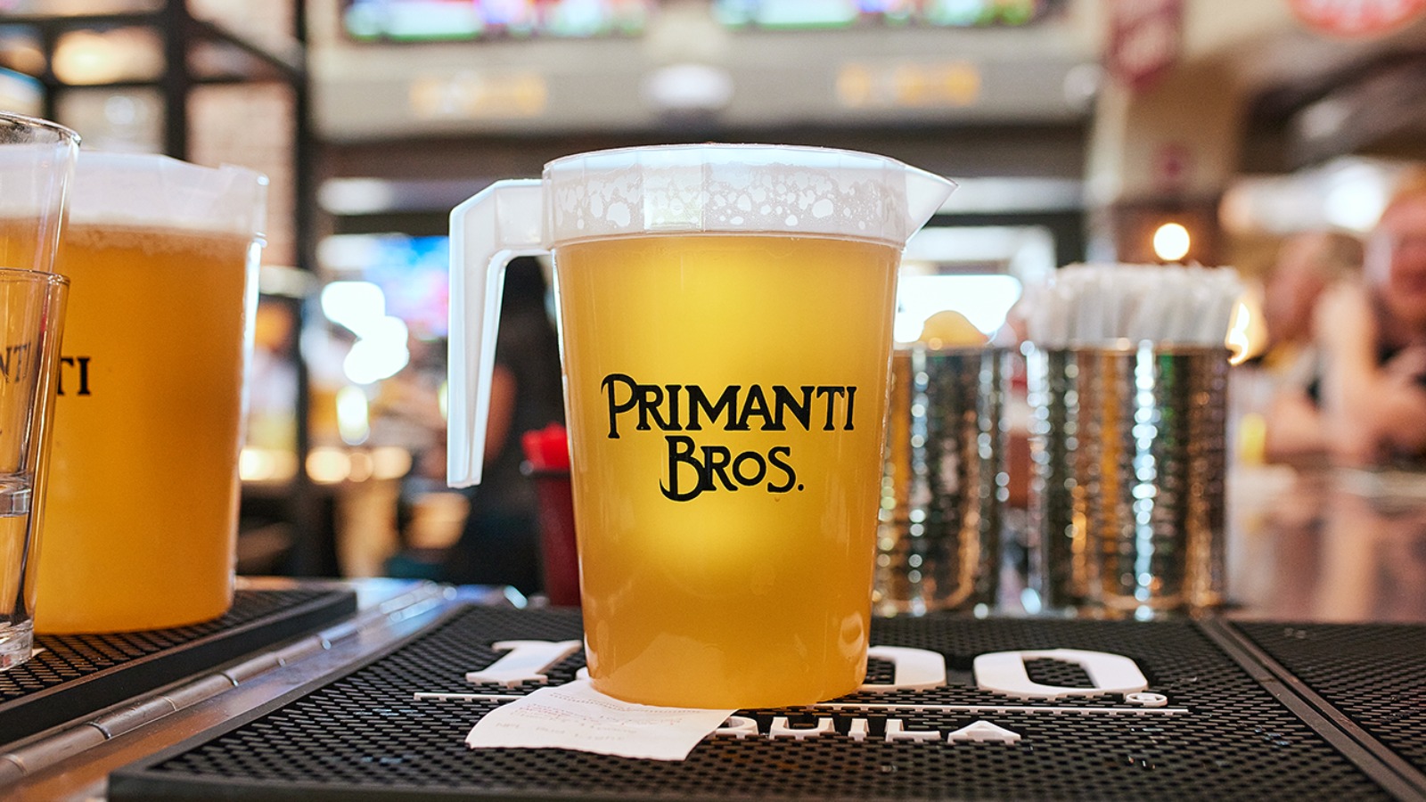 a pitcher of beer on a counter