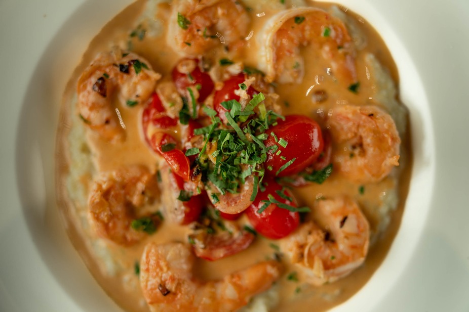 a plate of shrimp & grits