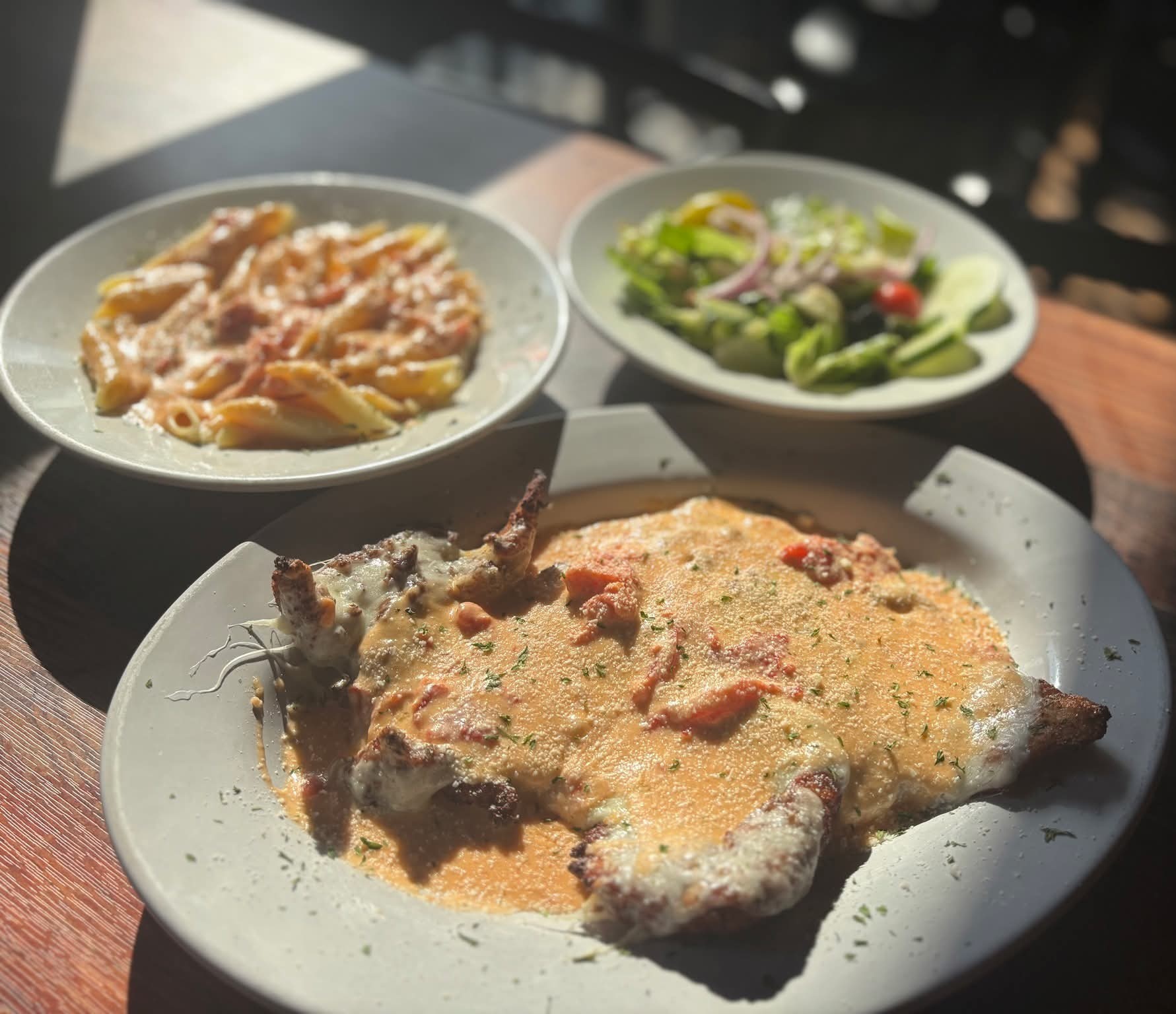 three plates of food on a table