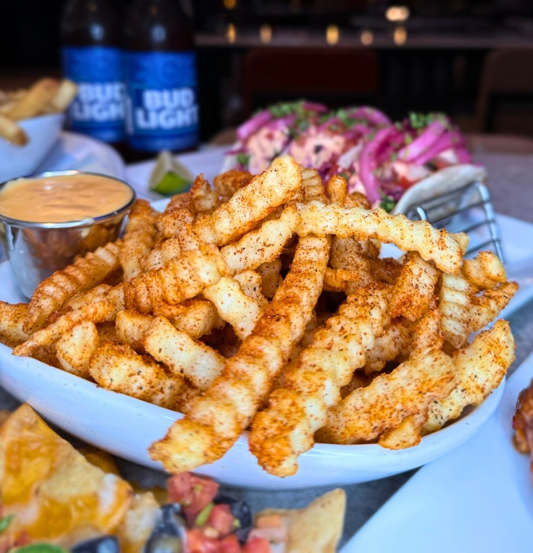 a plate of sweet bay fries with dip