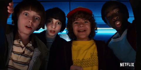 a gif of Will, Mike, Dustin, and Lucas excitedly shouting from the POV of a arcade game